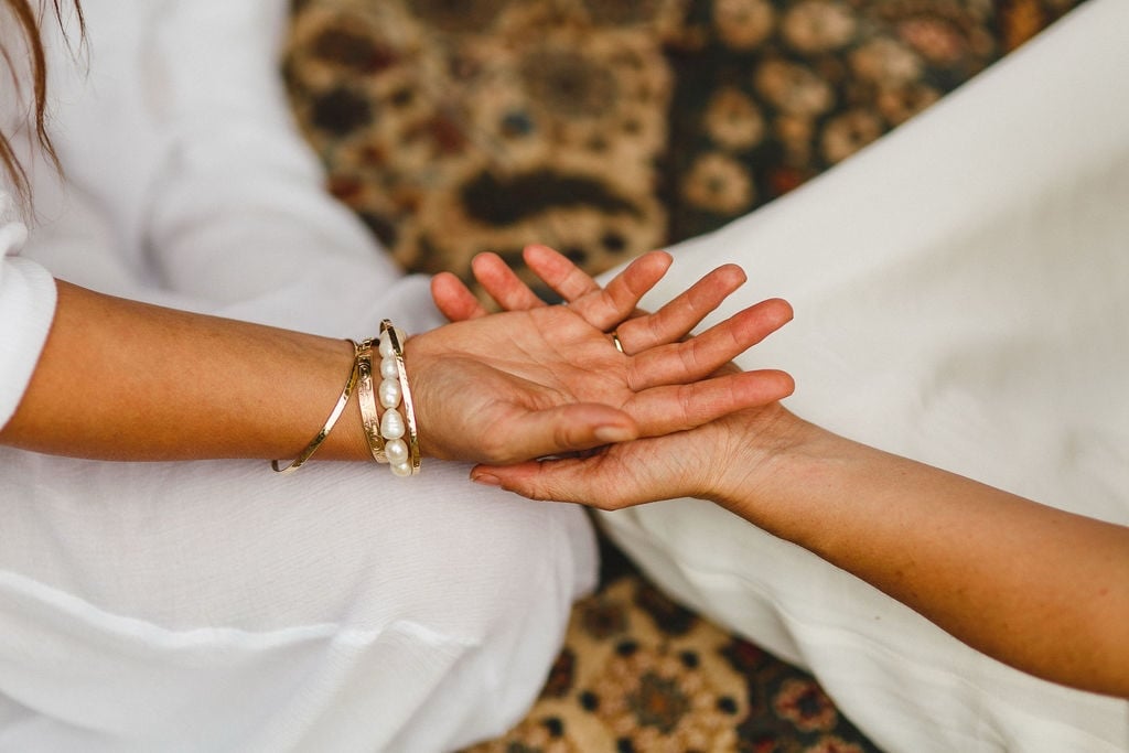 One open hand resting in another